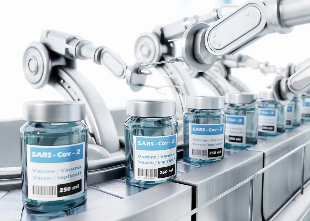 Scientists in a pharmaceutical lab using AI-powered equipment for drug research