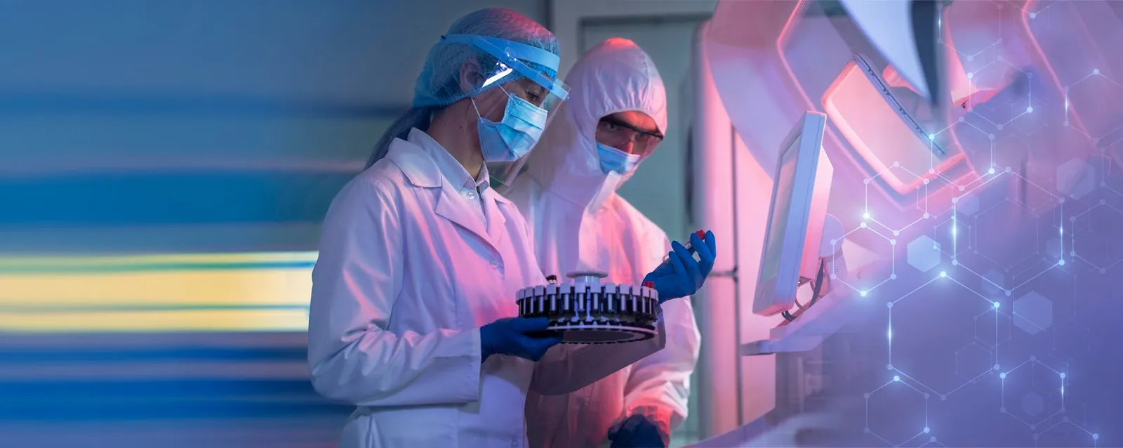 Scientists in a pharmaceutical lab using AI-powered equipment for drug research